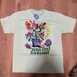 MARKET STUDIOS Light Sky Blue “Tend The Garden” T Shirt Size XL